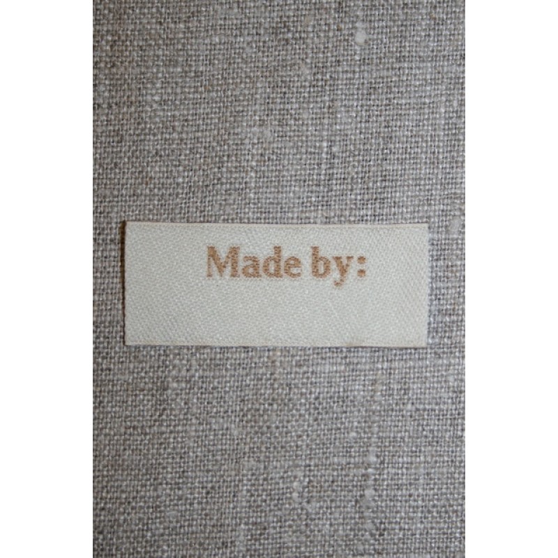 Beige mærke - label "Made by"