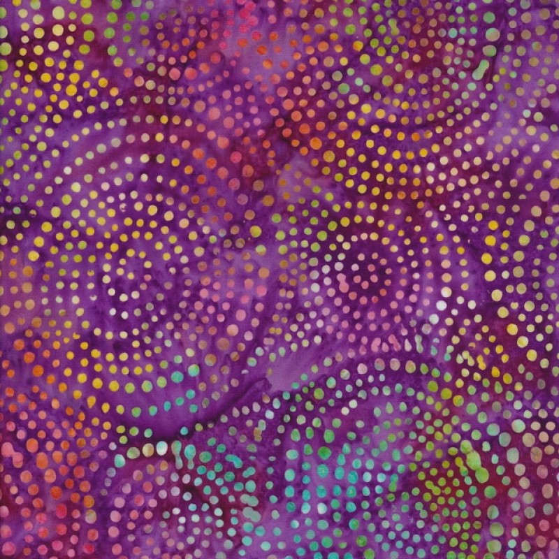 Patchworkstof batik med prikker i cirkler i cerisse