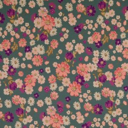 Bomuld/elasthan økotex i lys petrol/grøn med blomster i lilla, lys rosa, knækket hvid.