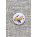 Rund knap i hvid med flyvemaskine