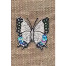 Strygemærke med hvid sommerfugl med pallietter